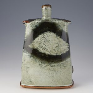 James Hake Ceramics - Thrown and altered vase. Nuka and Tenmoku overlaps,