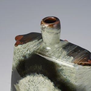 James Hake Ceramics - Thrown and altered vase with Nuka and Tenmoku glazes.