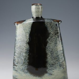 James Hake Ceramics - Thrown and altered vase with Nuka and Tenmoku glazes..